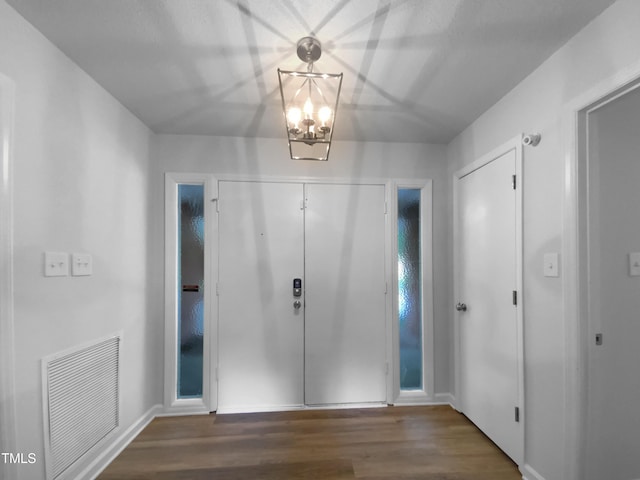 3721 Suffolk St, Durham, NC 27707 - entrance foyer with wood finished floors and a chandelier