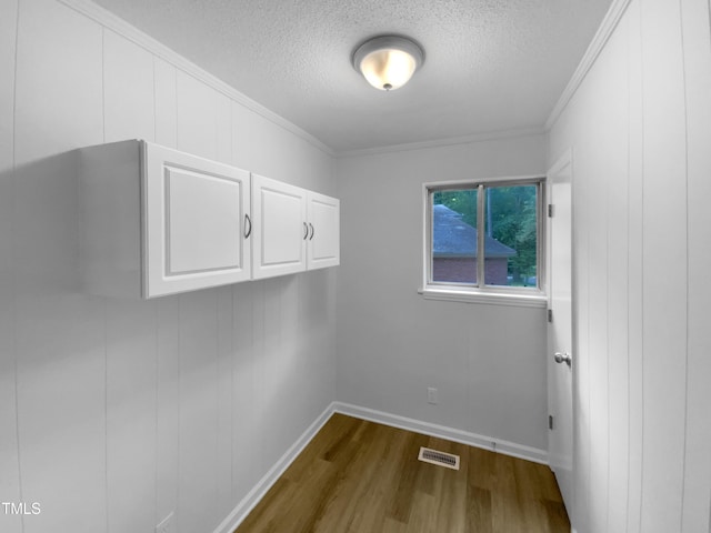 3721 Suffolk St, Durham, NC 27707 - washroom featuring a textured ceiling, dark wood-type flooring, and crown molding