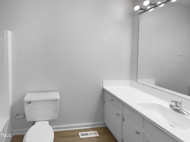 3721 Suffolk St, Durham, NC 27707 - bathroom with vanity and wood finished floors