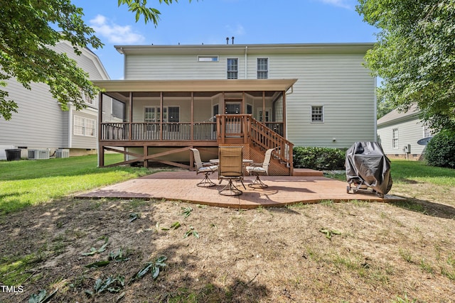 2027 River Grove Ln, Knightdale, NC 27545 - back of house featuring a sunroom, a patio, a lawn, and stairs