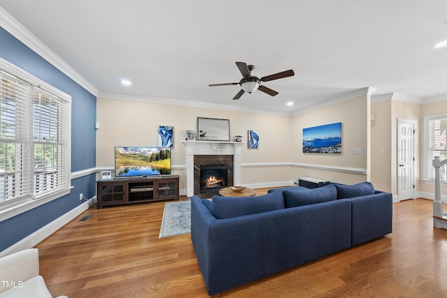 2027 River Grove Ln, Knightdale, NC 27545 - living area featuring a fireplace, ceiling fan, recessed lighting, crown molding, and wood finished floors