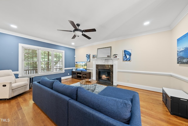 2027 River Grove Ln, Knightdale, NC 27545 - living area with ceiling fan, a premium fireplace, ornamental molding, light wood-type flooring, and recessed lighting