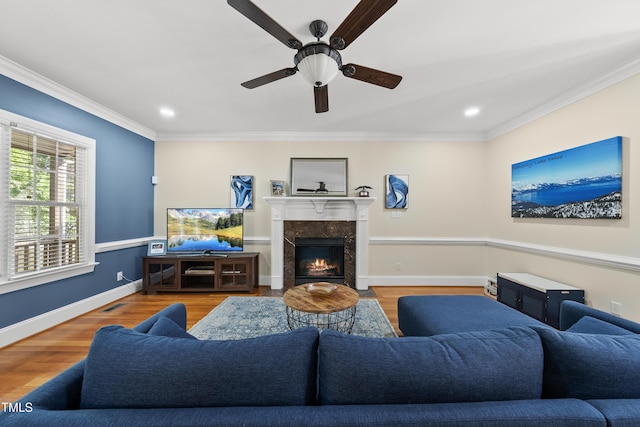 2027 River Grove Ln, Knightdale, NC 27545 - living room with ornamental molding, wood finished floors, ceiling fan, a fireplace, and recessed lighting