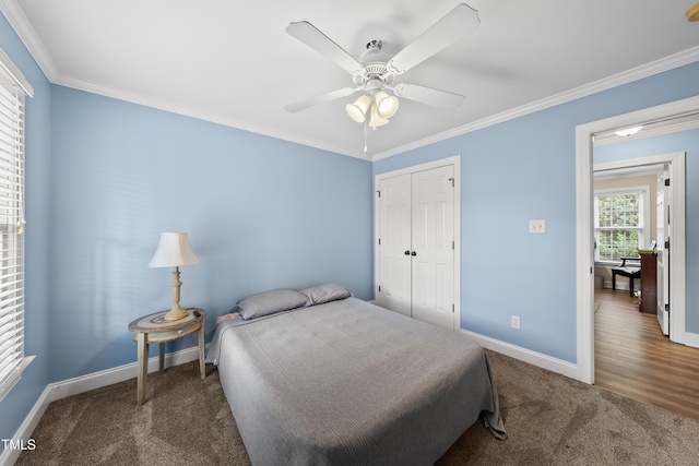 2027 River Grove Ln, Knightdale, NC 27545 - carpeted bedroom with crown molding, a closet, and ceiling fan