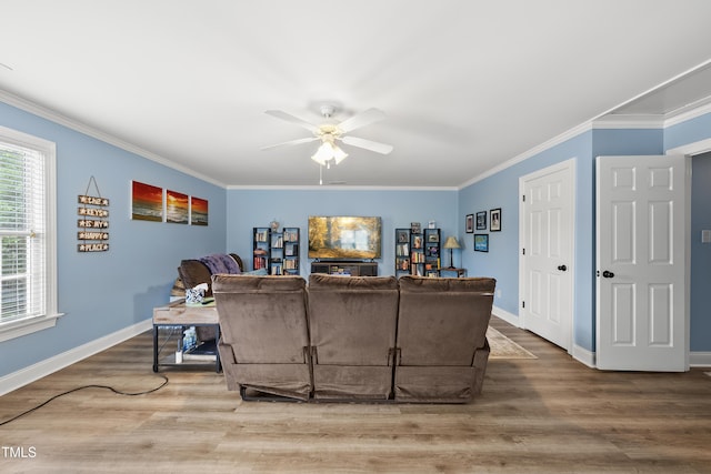 2027 River Grove Ln, Knightdale, NC 27545 - living area featuring a ceiling fan, wood finished floors, and ornamental molding