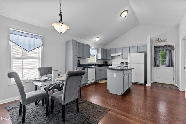 4505 Woodlawn Dr, Raleigh, NC 27616 - kitchen with gray cabinetry, white appliances, under cabinet range hood, dark countertops, and high vaulted ceiling