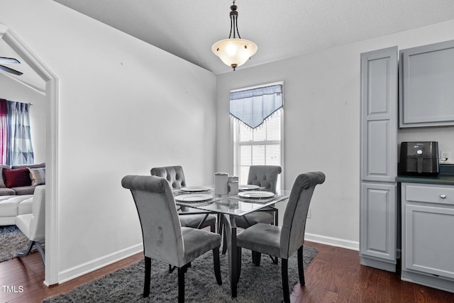 4505 Woodlawn Dr, Raleigh, NC 27616 - dining space with dark wood-style floors and baseboards