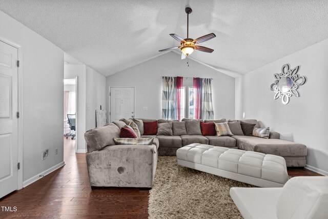 4505 Woodlawn Dr, Raleigh, NC 27616 - living area featuring a textured ceiling, dark wood-type flooring, ceiling fan, and lofted ceiling