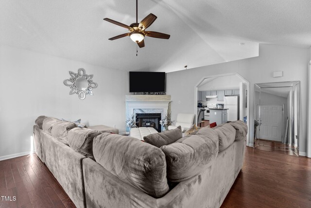 4505 Woodlawn Dr, Raleigh, NC 27616 - living area with ceiling fan, lofted ceiling, dark wood-type flooring, and a premium fireplace