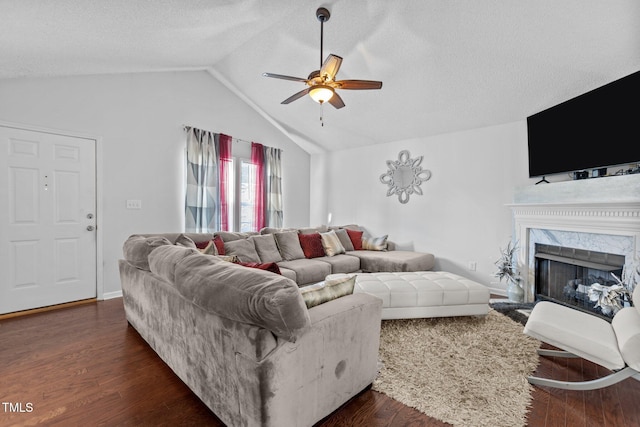 4505 Woodlawn Dr, Raleigh, NC 27616 - living room with ceiling fan, lofted ceiling, a textured ceiling, a fireplace, and dark wood finished floors