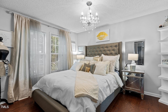 4505 Woodlawn Dr, Raleigh, NC 27616 - bedroom with a textured ceiling, a chandelier, and wood finished floors