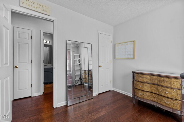 4505 Woodlawn Dr, Raleigh, NC 27616 - bedroom featuring wood finished floors and a textured ceiling