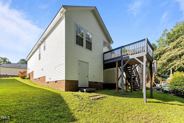 4505 Woodlawn Dr, Raleigh, NC 27616 - back of property with a wooden deck, crawl space, a yard, and stairs