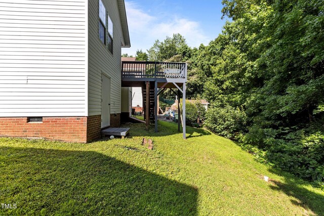 4505 Woodlawn Dr, Raleigh, NC 27616 - view of green lawn featuring a deck and stairway