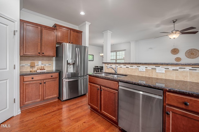 2007 October Dr, Durham, NC 27703 - kitchen with stainless steel appliances, backsplash, ceiling fan, dark stone counters, and recessed lighting