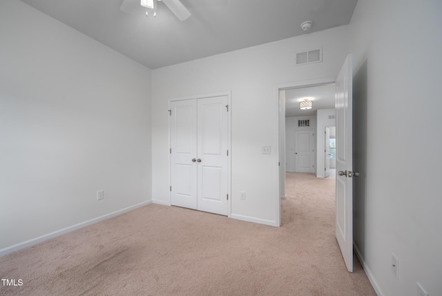 2007 October Dr, Durham, NC 27703 - unfurnished bedroom featuring carpet floors, a closet, and ceiling fan