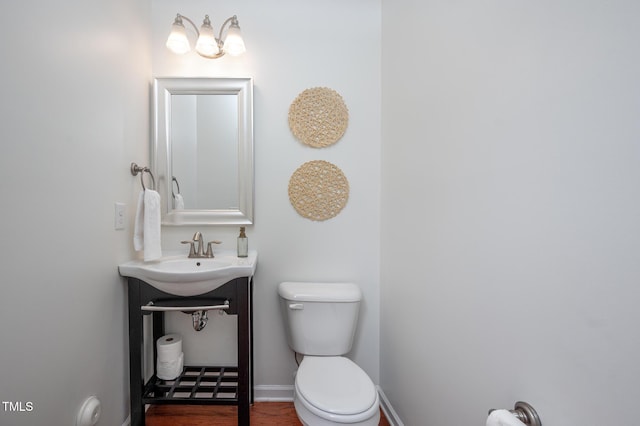 2007 October Dr, Durham, NC 27703 - half bath with toilet and wood finished floors