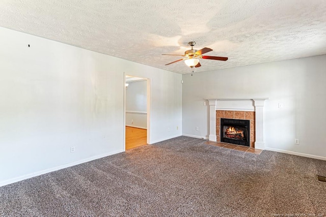 5228 Wallbrook Dr, Fayetteville, NC 28306 - unfurnished living room with ceiling fan, a tile fireplace, carpet floors, and a textured ceiling