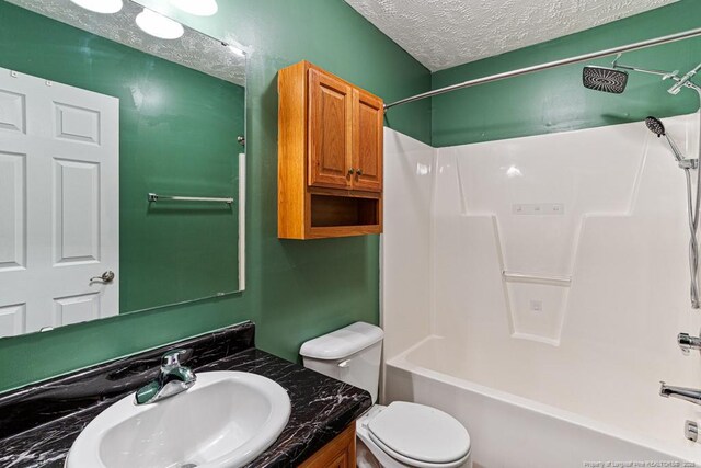 5228 Wallbrook Dr, Fayetteville, NC 28306 - bathroom featuring vanity, bathtub / shower combination, and a textured ceiling