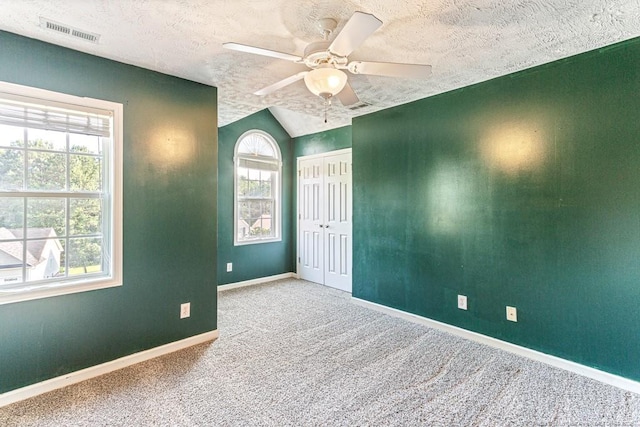 5228 Wallbrook Dr, Fayetteville, NC 28306 - carpeted spare room featuring a textured ceiling, ceiling fan, and vaulted ceiling