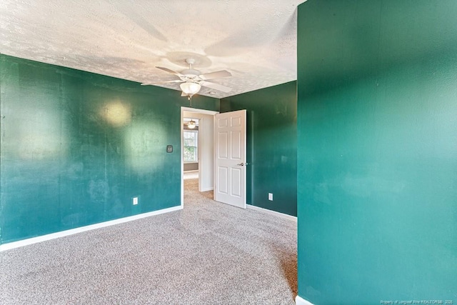 5228 Wallbrook Dr, Fayetteville, NC 28306 - carpeted empty room with ceiling fan and a textured ceiling