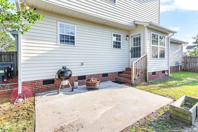 5228 Wallbrook Dr, Fayetteville, NC 28306 - back of property featuring crawl space, entry steps, a patio area, and a fire pit