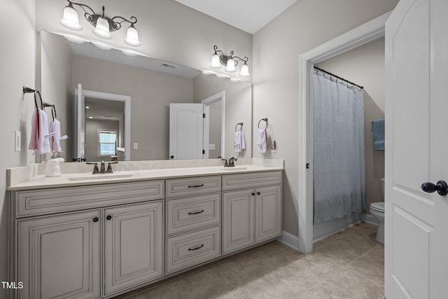 317 Striped Maple Ct, Apex, NC 27539 - bathroom featuring double vanity and tile patterned flooring