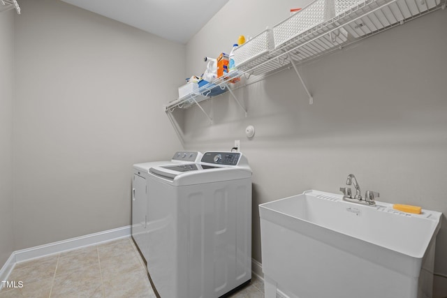 317 Striped Maple Ct, Apex, NC 27539 - laundry area with washing machine and clothes dryer and baseboards