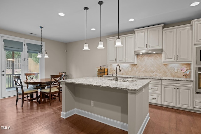 317 Striped Maple Ct, Apex, NC 27539 - kitchen featuring backsplash, recessed lighting, dark wood-style floors, oven, and light stone counters