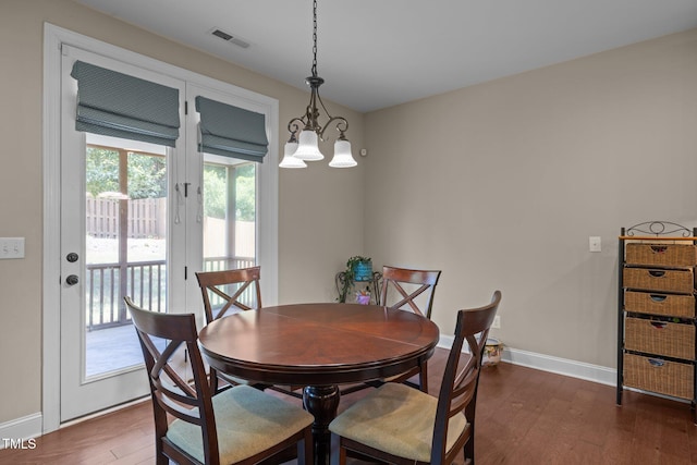 317 Striped Maple Ct, Apex, NC 27539 - dining space with dark wood-style flooring and a chandelier