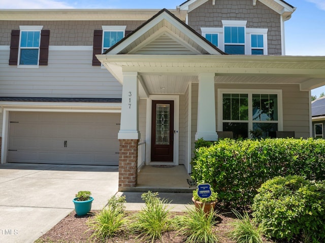 317 Striped Maple Ct, Apex, NC 27539 - view of front of house featuring driveway and covered porch