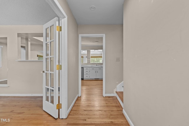 4404 Susan Dr, Raleigh, NC 27603 - corridor with wood finished floors and stairs