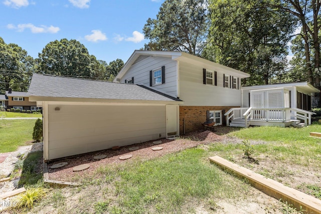 4404 Susan Dr, Raleigh, NC 27603 - view of side of home featuring brick siding, a deck, and a yard