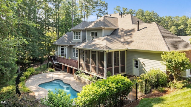 1028 Harpers Ridge Ct, Wake Forest, NC 27587 - back of house with a sunroom, a shingled roof, a fenced backyard, a wooden deck, and stairs