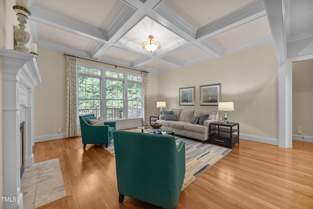 1028 Harpers Ridge Ct, Wake Forest, NC 27587 - living room featuring a fireplace with flush hearth, light wood-style floors, coffered ceiling, beamed ceiling, and crown molding
