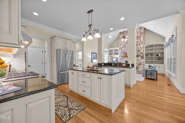 1028 Harpers Ridge Ct, Wake Forest, NC 27587 - kitchen featuring stainless steel appliances, a center island, light wood finished floors, recessed lighting, and pendant lighting