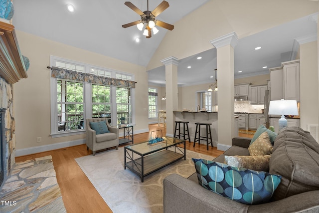 1028 Harpers Ridge Ct, Wake Forest, NC 27587 - living room with decorative columns, ceiling fan, light wood-type flooring, recessed lighting, and high vaulted ceiling