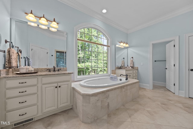 1028 Harpers Ridge Ct, Wake Forest, NC 27587 - bathroom featuring crown molding, vanity, a garden tub, and tile patterned floors
