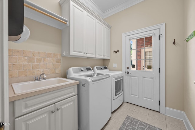 1028 Harpers Ridge Ct, Wake Forest, NC 27587 - laundry room featuring washer and dryer, cabinet space, ornamental molding, and light tile patterned floors