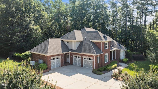 1028 Harpers Ridge Ct, Wake Forest, NC 27587 - craftsman inspired home featuring a garage, brick siding, concrete driveway, and a front lawn