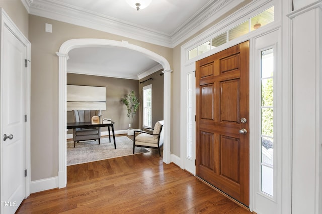 307 Beacon Falls Ct, Cary, NC 27519 - foyer entrance featuring arched walkways, wood finished floors, crown molding, and ornate columns
