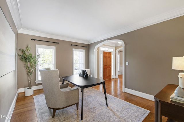 307 Beacon Falls Ct, Cary, NC 27519 - dining room with arched walkways, ornamental molding, and wood finished floors