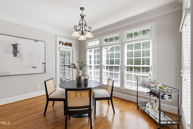 307 Beacon Falls Ct, Cary, NC 27519 - dining room featuring crown molding, wood finished floors, and a chandelier