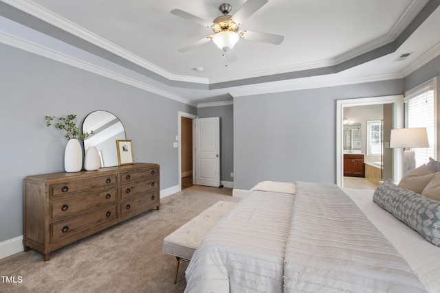 307 Beacon Falls Ct, Cary, NC 27519 - bedroom with a tray ceiling, light carpet, ornamental molding, connected bathroom, and ceiling fan