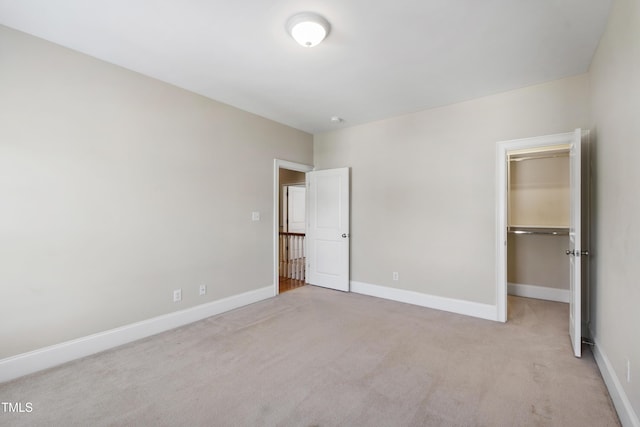 307 Beacon Falls Ct, Cary, NC 27519 - unfurnished bedroom with carpet, a walk in closet, and a closet