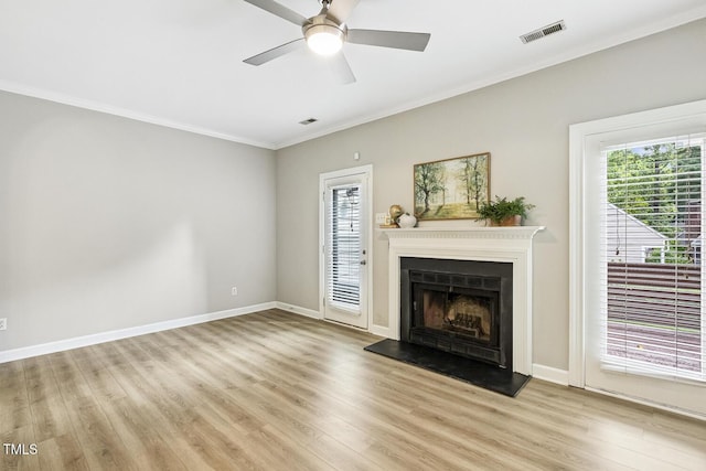 212 Cross Keys Ct, Cary, NC 27511 - unfurnished living room featuring light wood-style floors, ornamental molding, a fireplace with raised hearth, and a ceiling fan