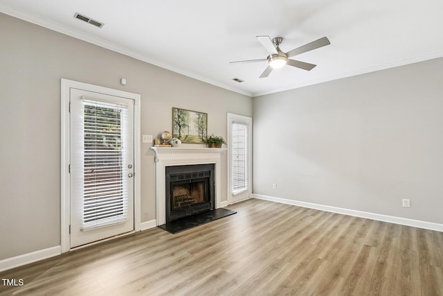 212 Cross Keys Ct, Cary, NC 27511 - unfurnished living room featuring light wood-type flooring, ornamental molding, ceiling fan, and a fireplace