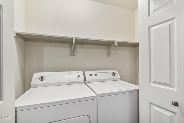 212 Cross Keys Ct, Cary, NC 27511 - laundry area with washer and dryer and a textured ceiling