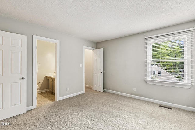 212 Cross Keys Ct, Cary, NC 27511 - unfurnished bedroom featuring carpet floors, a textured ceiling, and ensuite bathroom