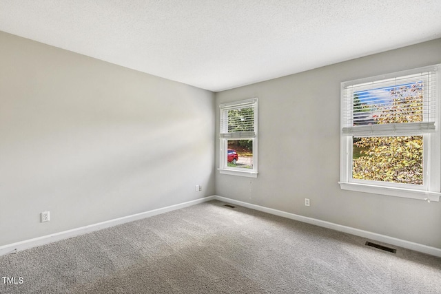 212 Cross Keys Ct, Cary, NC 27511 - carpeted spare room with baseboards and a textured ceiling